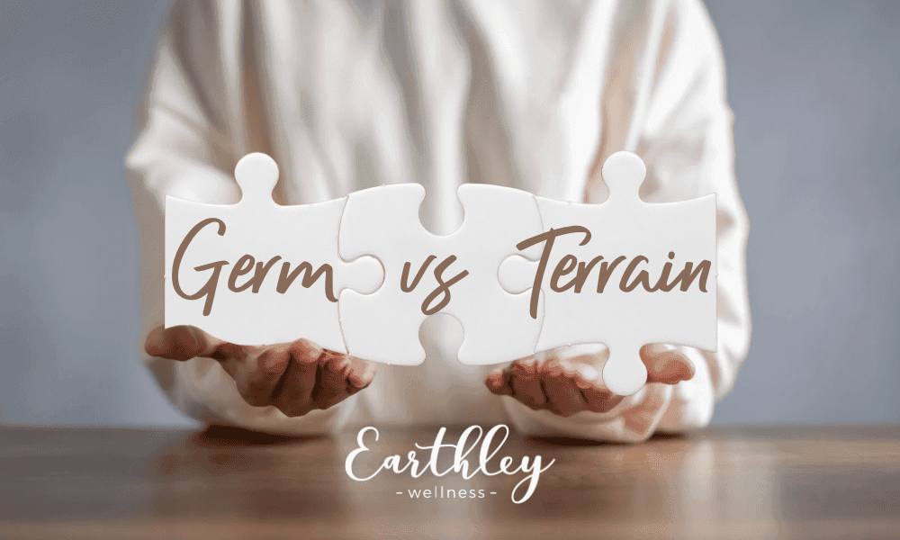 Germ vs Terrain theory comparison graphic showing woman in cream sweater holding two white puzzle pieces on wooden table