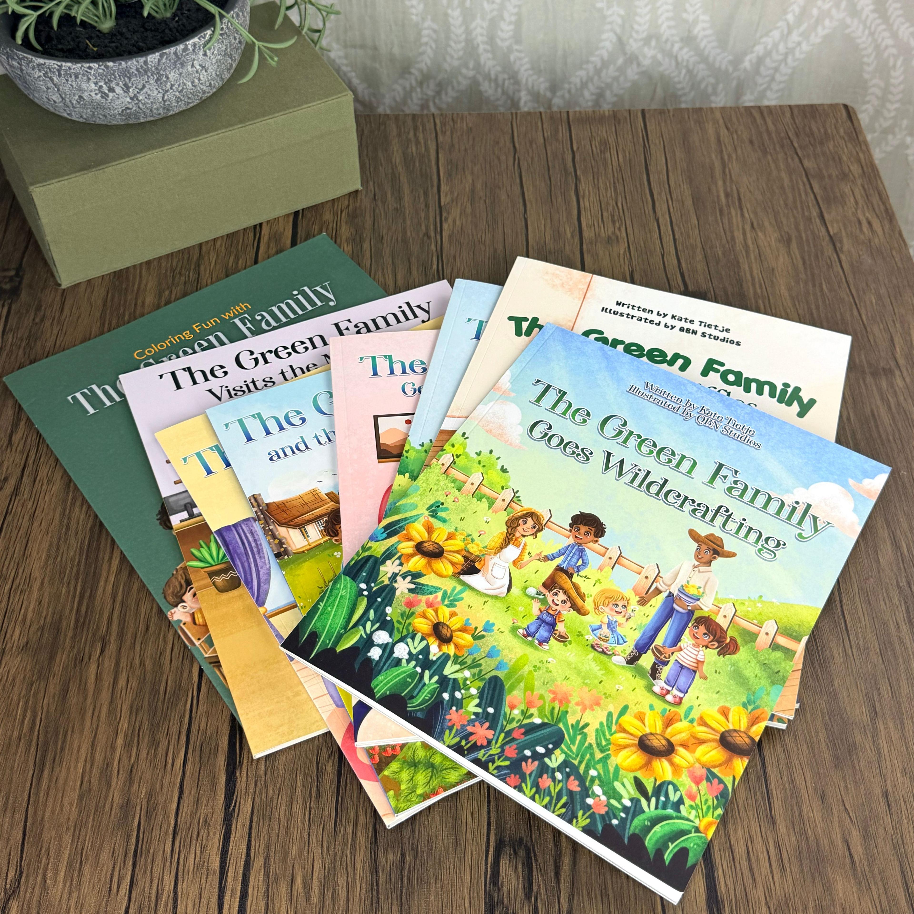 Fan of Green Family children's books on wood table, including Goes Wildcrafting title