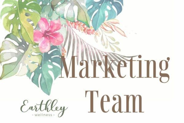 Earthley Marketing Team group photo showing employees smiling together in modern office with cream walls and natural lighting