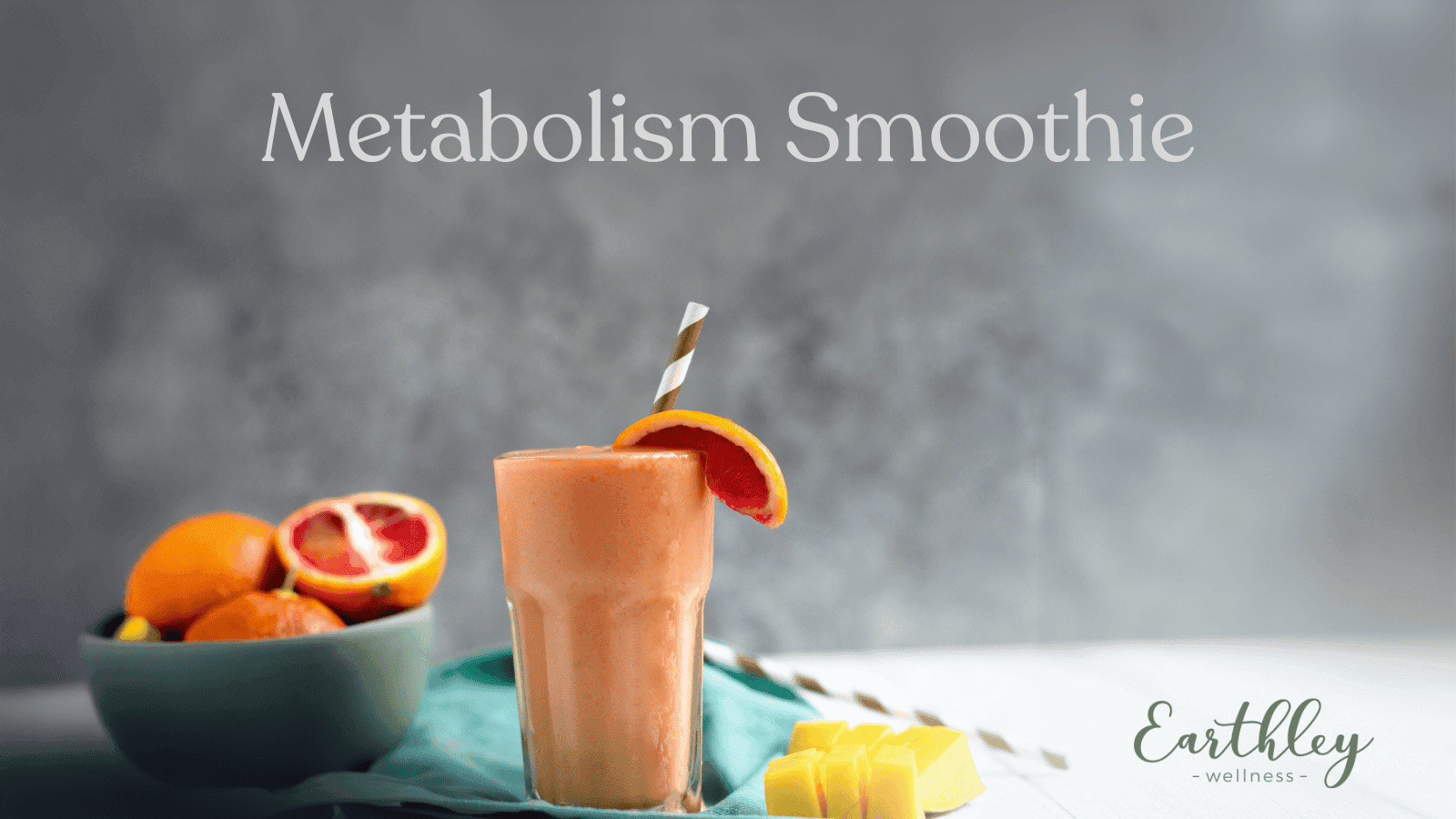 Metabolism Smoothie recipe header showing peach orange blended smoothie in clear glass with blood orange slices on teal cloth and gray background