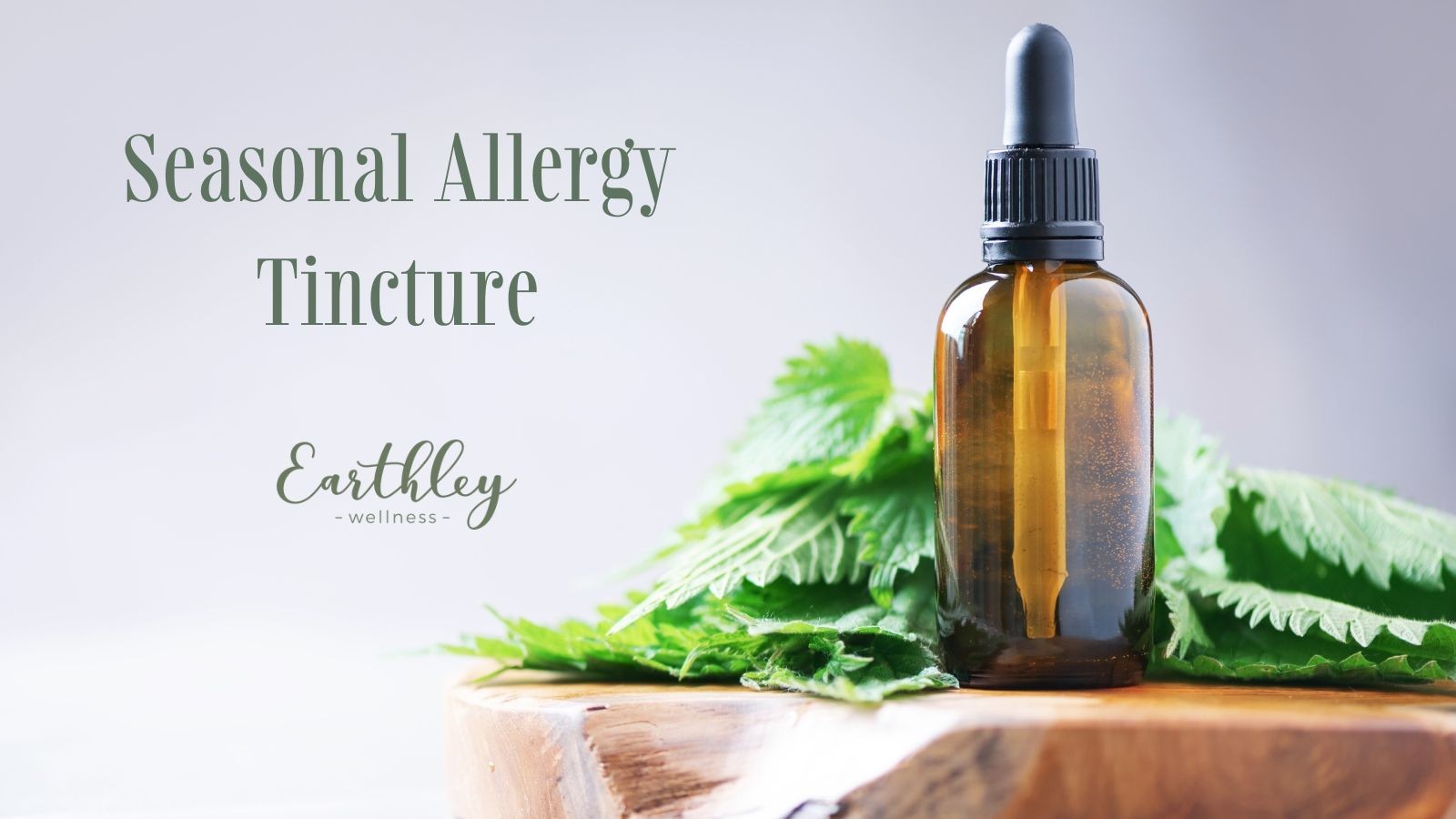 Seasonal Allergy Tincture product header showing amber glass dropper bottle with black cap on tan brown wooden board with bright green nettle leaves on gray white background with olive green text