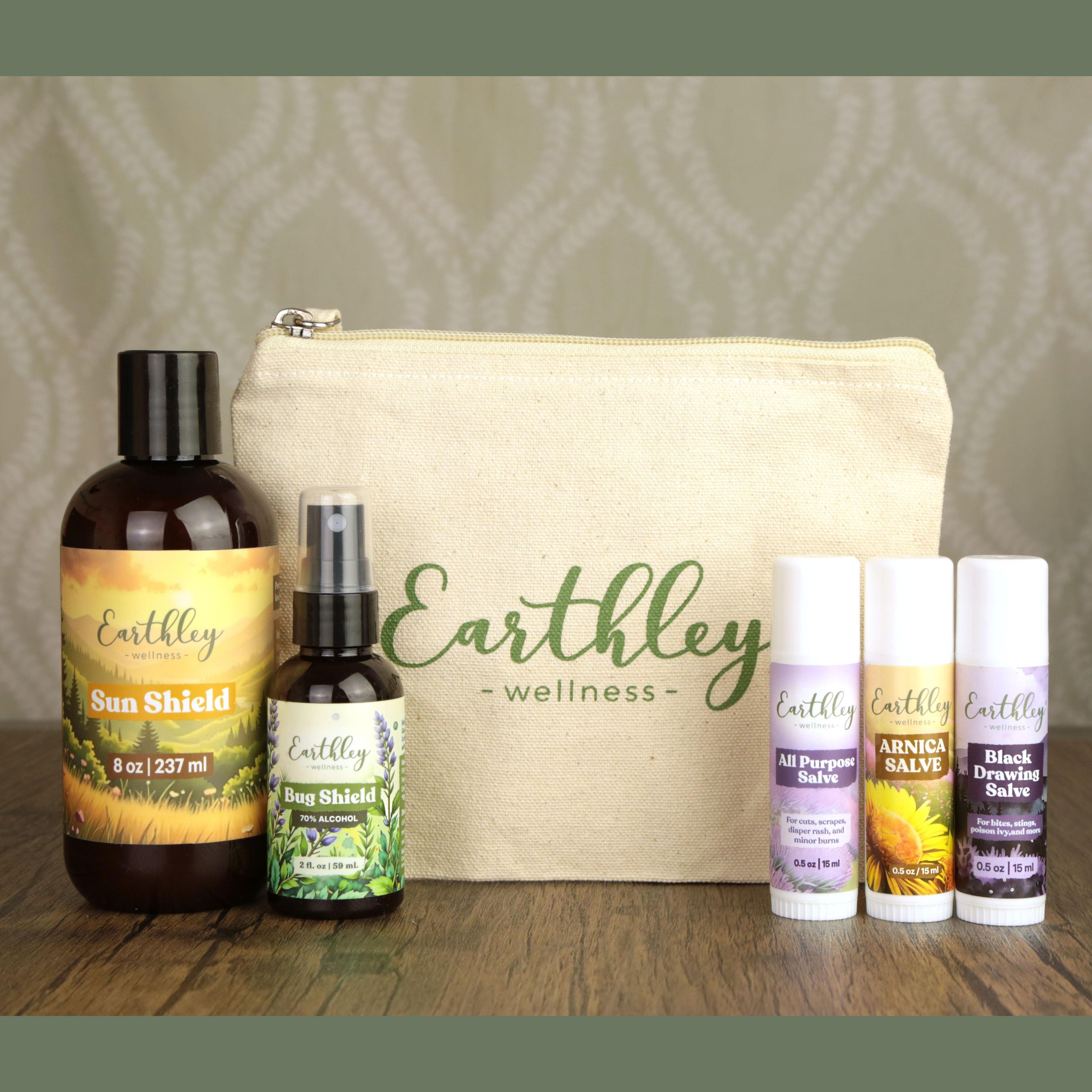 Earthley Wellness natural skincare bundle with canvas pouch, Sun Shield lotion, Bug Shield spray, and three healing salves