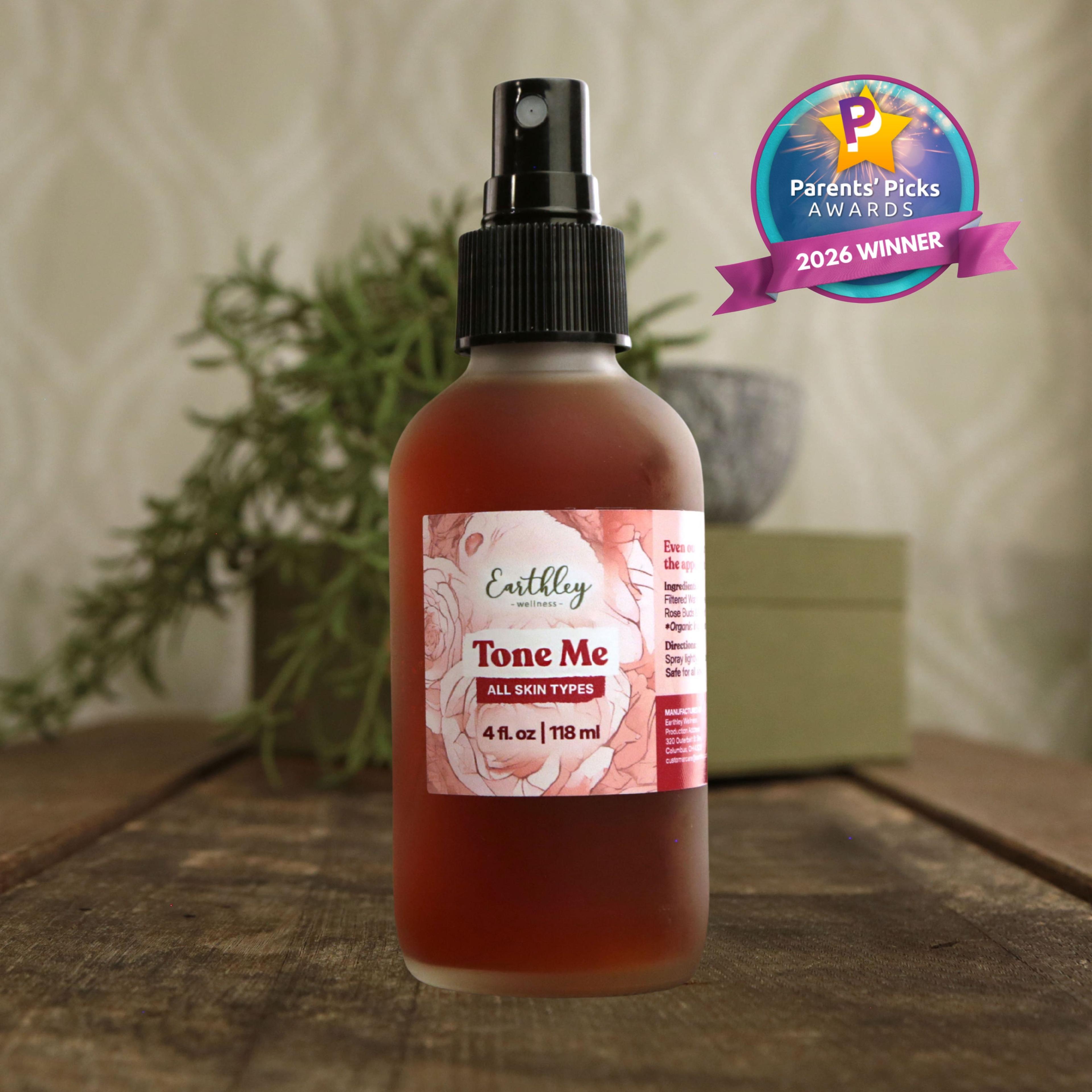 Earthley Tone Me facial toner spray bottle with rose-colored liquid and Parents' Picks Awards 2026 Winner badge