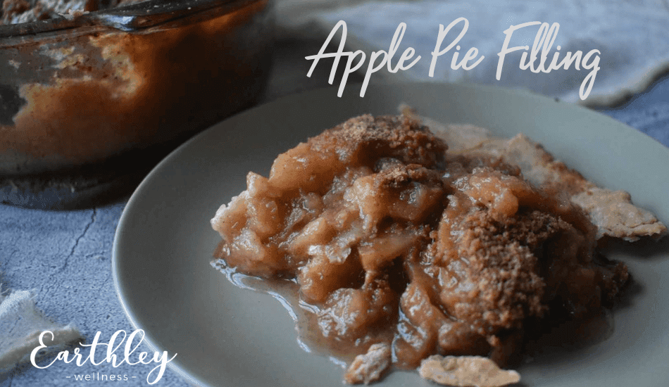 Apple Pie Filling recipe header showing golden brown cinnamon apple chunks on gray plate with pie dish in background and brown sugar crumble topping