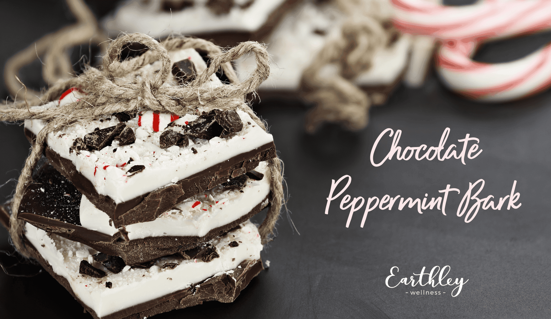 Chocolate Peppermint Bark recipe showing stacked layers of dark brown chocolate and white cream coating with red and white striped candy canes on dark gray background