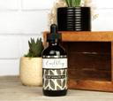 Earthley Gut Health Oil amber bottle with green botanical label for digestive system support