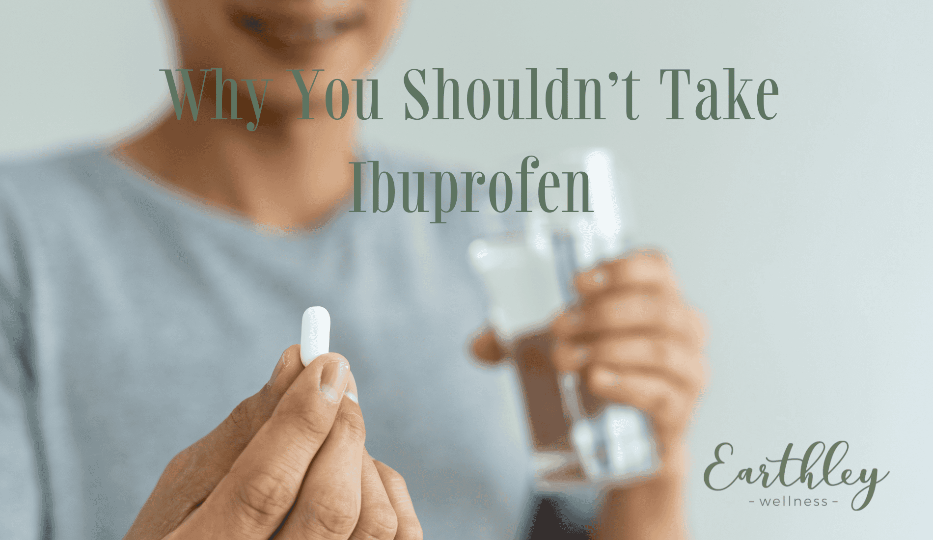 Why You Shouldnt Take Ibuprofen blog header showing person in gray t-shirt holding white pill in one hand and clear glass of water in other hand with soft focus background