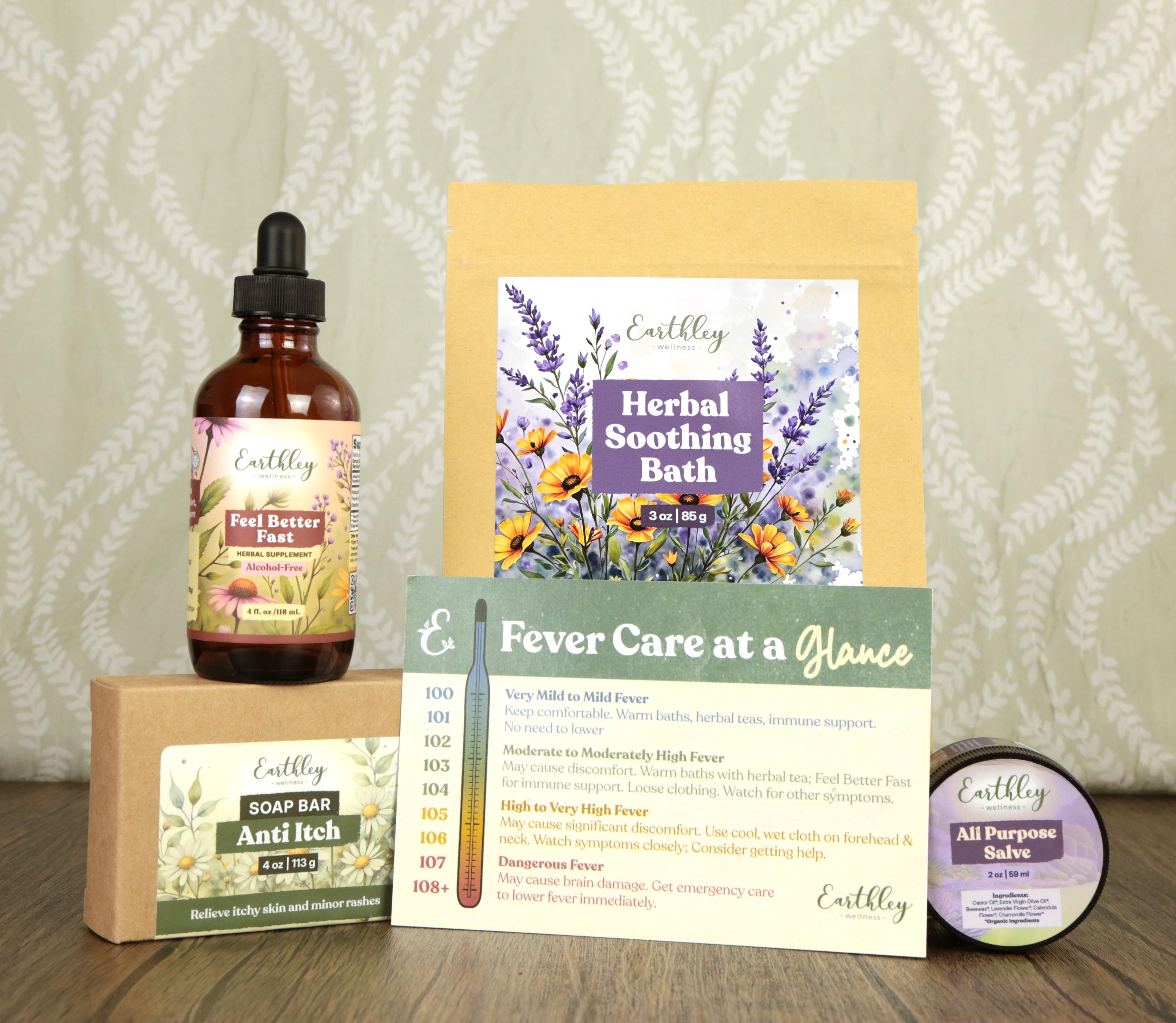 Earthley Viral Rash Support bundle showing Feel Better Fast tincture, Herbal Soothing Bath packet, Anti Itch soap bar sample, All Purpose Salve tin, and Fever Care at a Glance reference card with thermometer illustration arranged on wooden surface